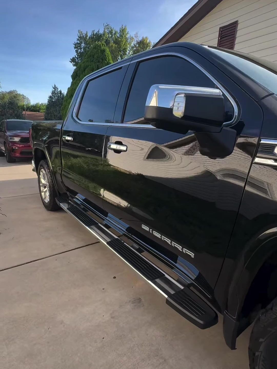Black GMC Sierra gleaming in the sun after a MAD exterior detail