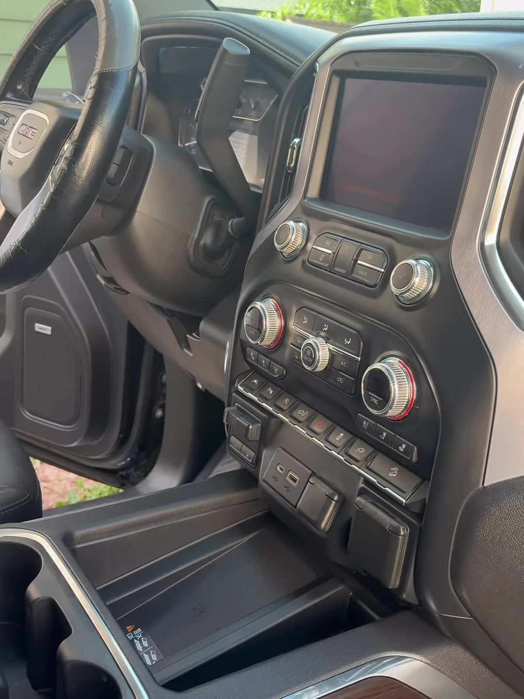GMC Sierra dashboard, screen and center console after an interior detail