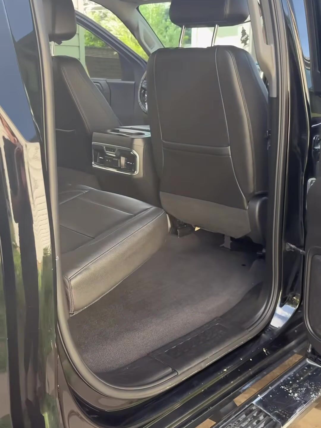 GMC Sierra rear leather seats and floor after an interior detail