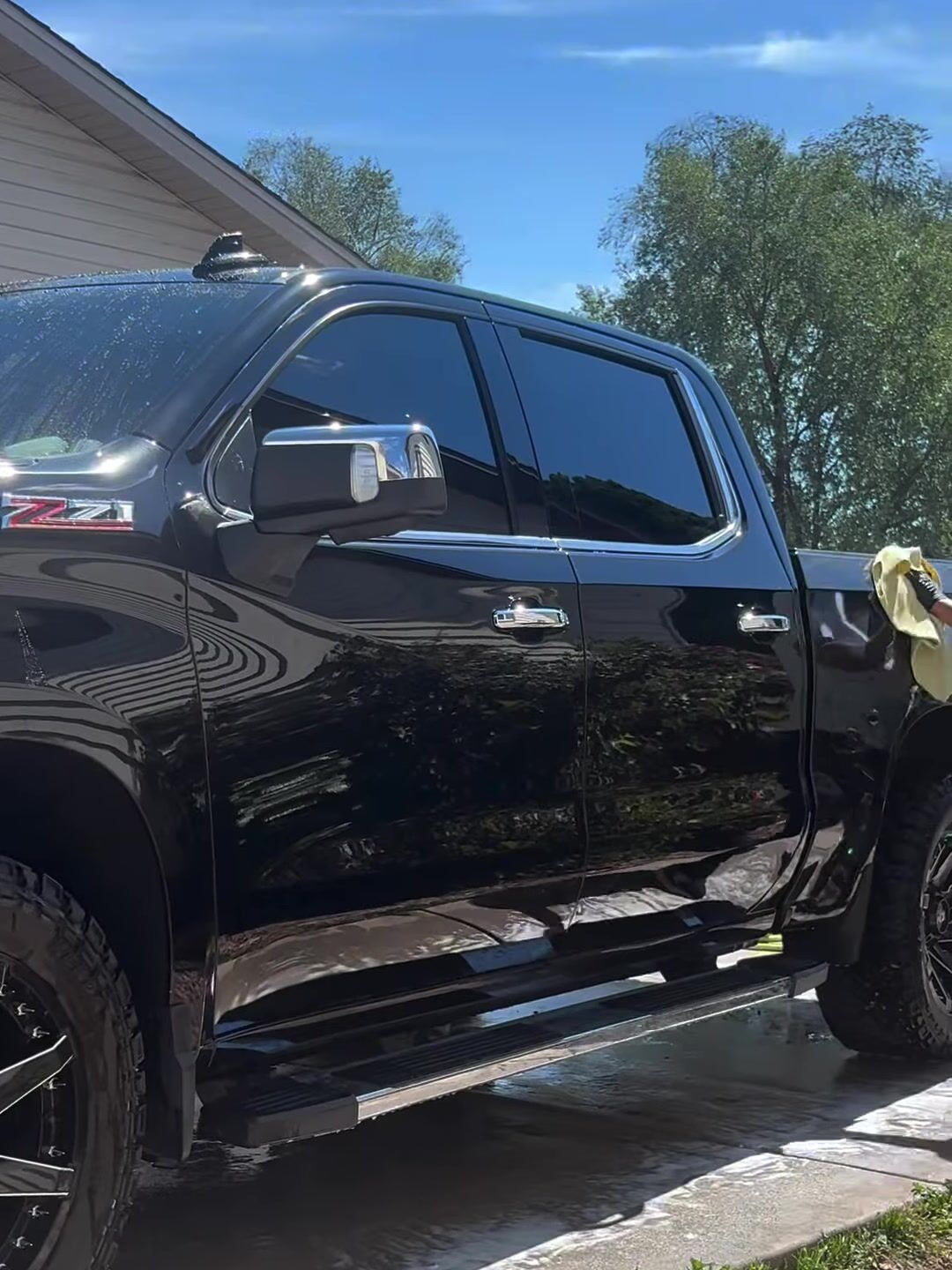 Black Chevy Silverado Z71 shining in the driveway